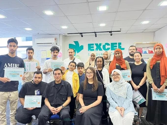 Graduation ceremony with students holding certificates