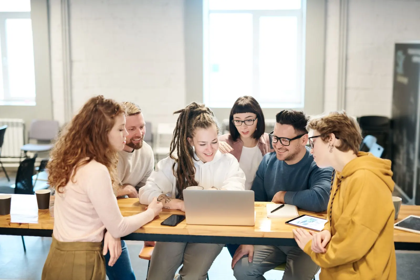 Young colleagues working together at a shared table