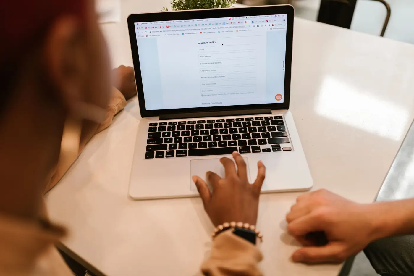 Filling in an online form on a laptop